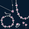 Pink heart-shaped cubic zirconia jewelry set with white gold plating featuring necklace, earrings, bracelet and ring