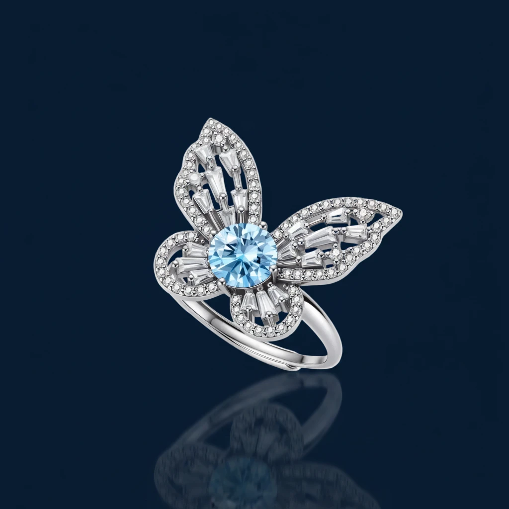 Sterling silver ring with blue moissanite center stone surrounded by clear stones in butterfly wing pattern on white background