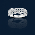 Sterling silver crossover ring with pavé-set moissanite stones creating an elegant infinity design on neutral background