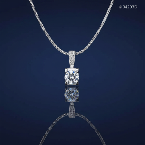 Sterling silver moissanite necklace on navy blue background