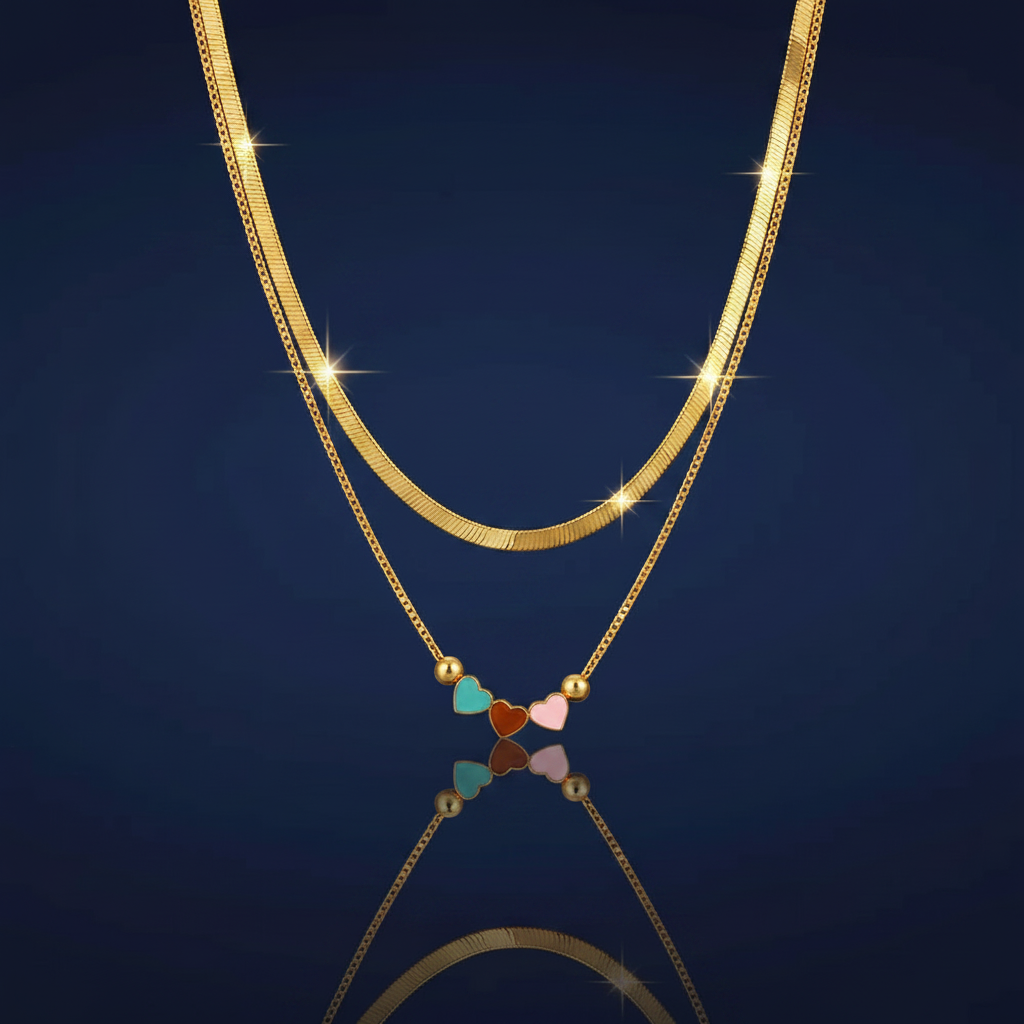 18K Gold-Plated Double Layered Herringbone and Heart Charm Necklace on navy blue background