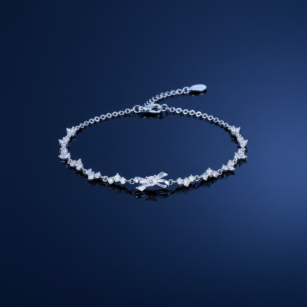 925 Sterling Silver Delicate Chain Bracelet with Bow Charm on navy blue background